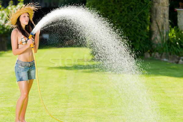 Stock photo: Summer garden woman play with water hose