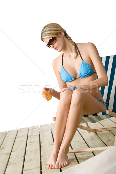 Plage jeune femme bikini bronzage lotion lunettes de soleil Photo stock © CandyboxPhoto