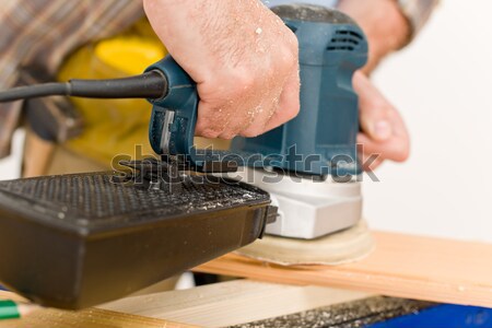 Home improvement - handyman sanding wooden floor Stock photo © CandyboxPhoto