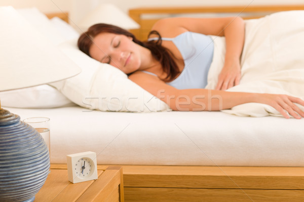 Alarm clock Woman sleeping in white bed Stock photo © CandyboxPhoto