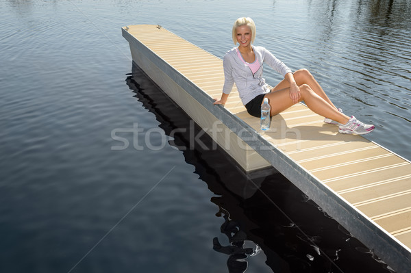Jungen Sport Frau entspannen Pier See Stock foto © CandyboxPhoto