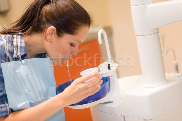 Dental patient woman spit water after treatment Stock photo © CandyboxPhoto