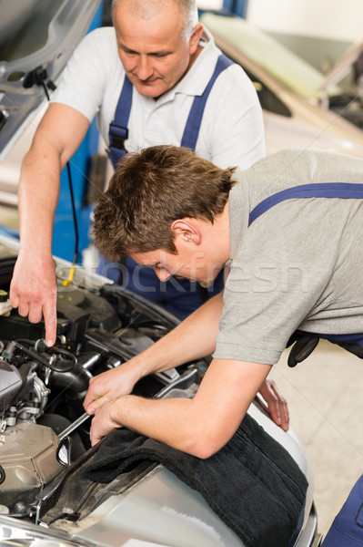 Stock photo: Middle aged car repairman helping colleague