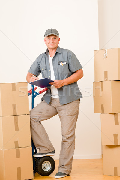 Messenger mature male courier delivering parcels Stock photo © CandyboxPhoto