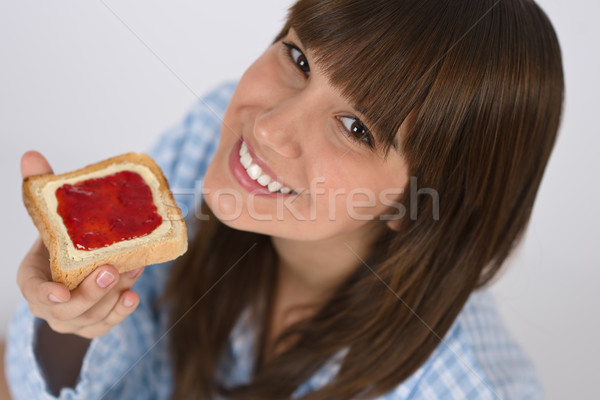 Felice adolescente pigiama mangiare sano toast colazione Foto d'archivio © CandyboxPhoto