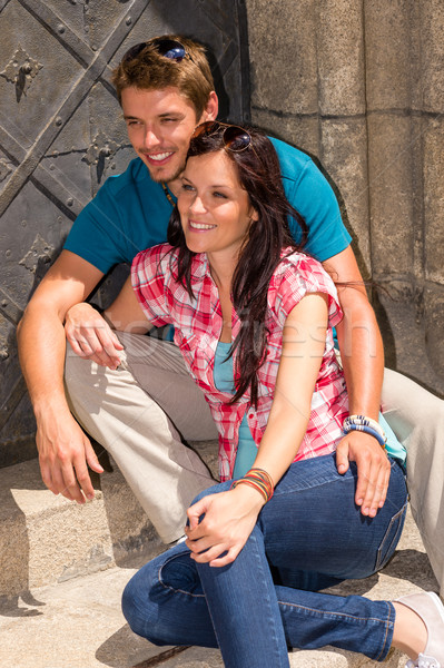 Young couple sitting on building steps smiling Stock photo © CandyboxPhoto