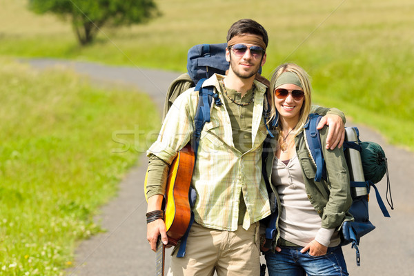 Hiking young couple backpack tramping asphalt road Stock photo © CandyboxPhoto