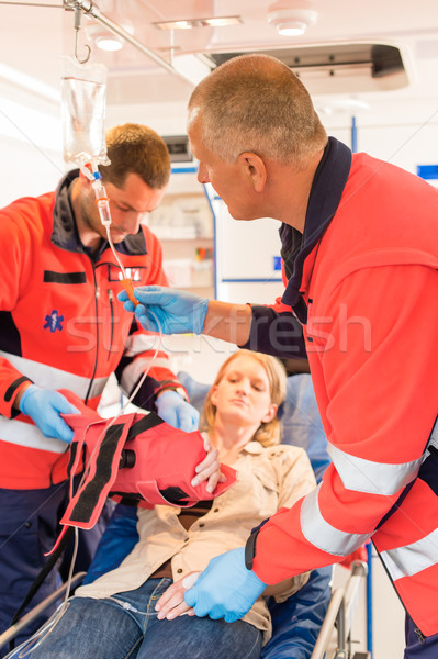 Paramedics in ambulance with patient broken arm Stock photo © CandyboxPhoto