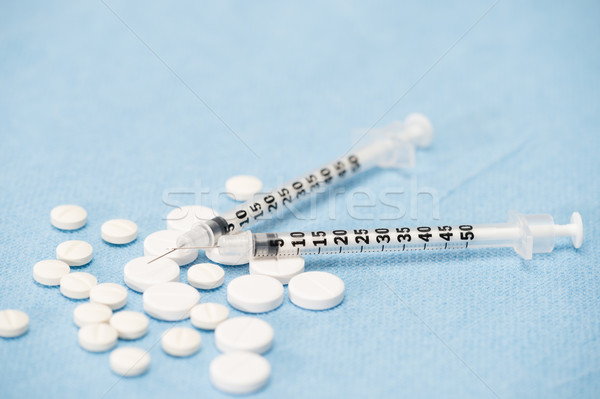 Two empty syringes with prescription pills Stock photo © CandyboxPhoto
