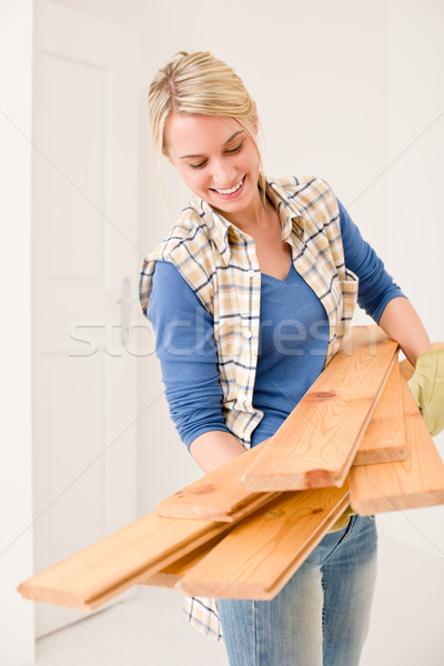 Home improvement - handywoman carry wooden plank Stock photo © CandyboxPhoto