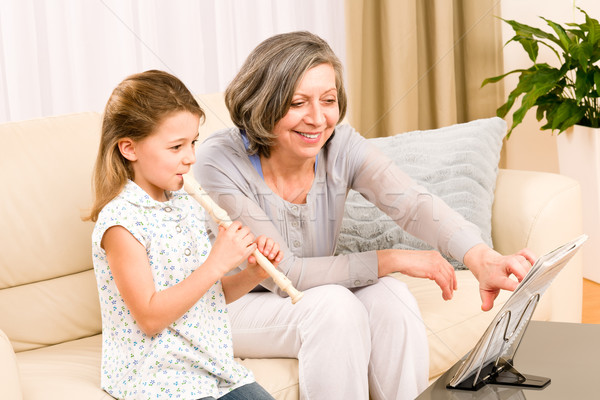 Grandmother teach young girl play flute happy Stock photo © CandyboxPhoto