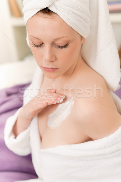 Stock photo: Young student girl apply body cream lotion