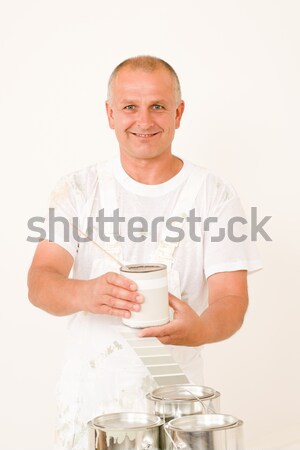 Stock photo: Home decorating mature male painter mix color