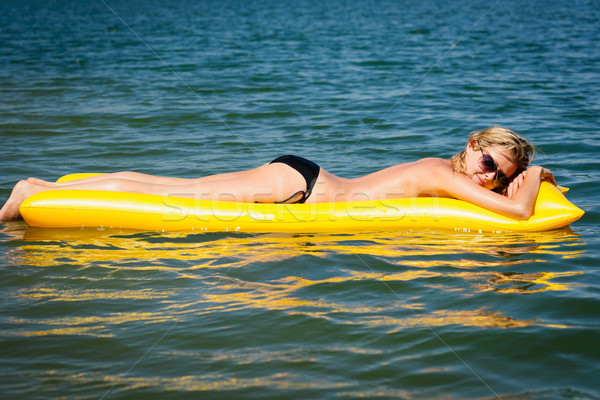 Nyár nő lebeg citromsárga víz matrac Stock fotó © CandyboxPhoto
