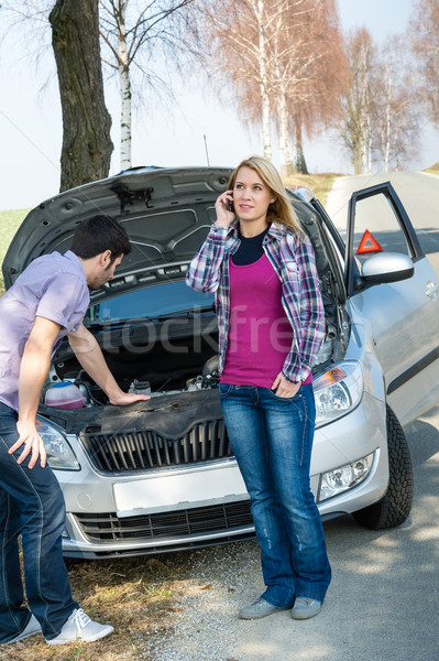 Stock photo: Car breakdown couple calling for road assistance