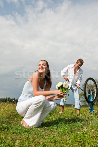 Romantic young couple with old bike in spring nature Stock photo © CandyboxPhoto