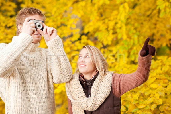 Stock photo: Autumn couple take photo camera in park