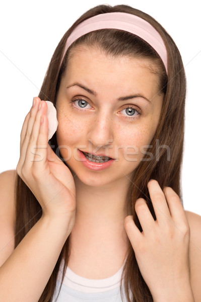 Girl cleaning face with cotton pad isolated Stock photo © CandyboxPhoto