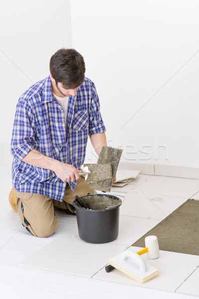 Home improvement - handyman laying tile Stock photo © CandyboxPhoto