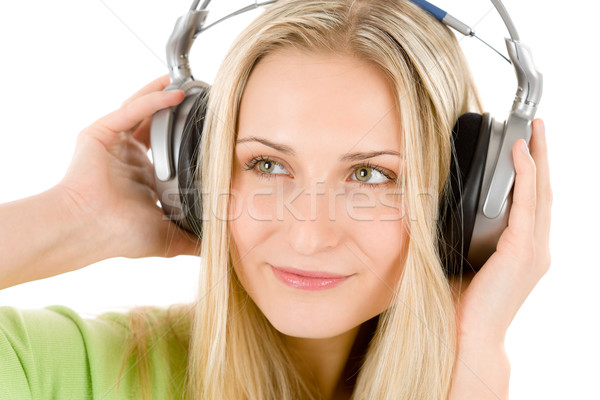 Stok fotoğraf: Genç · kadın · kulaklık · dinlemek · müzik · beyaz · yeşil