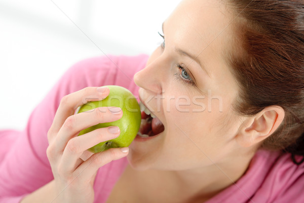 Fitness woman eat apple sportive outfit Stock photo © CandyboxPhoto
