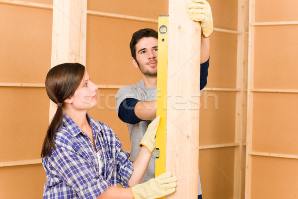 Stock photo: Home improvement smiling couple with spirit level