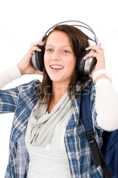 Smiling female teenager enjoy music headphones Stock photo © CandyboxPhoto