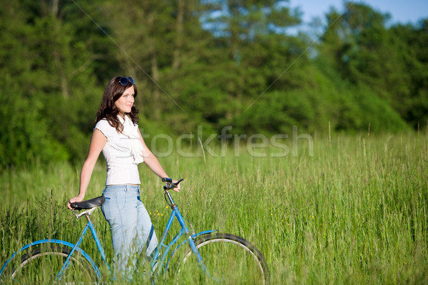 Woman with old-fashioned bike in summer meadow Stock photo © CandyboxPhoto