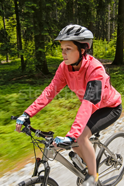 Woman mountain biking in forest motion blur Stock photo © CandyboxPhoto