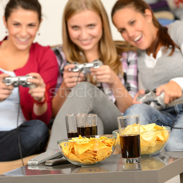 Smiling teenage girls playing with video games Stock photo © CandyboxPhoto