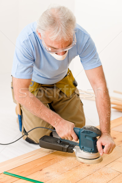 Home improvement - handyman sanding wooden floor  Stock photo © CandyboxPhoto