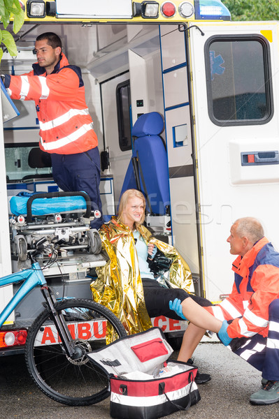 Paramedics with woman bike accident in ambulance Stock photo © CandyboxPhoto