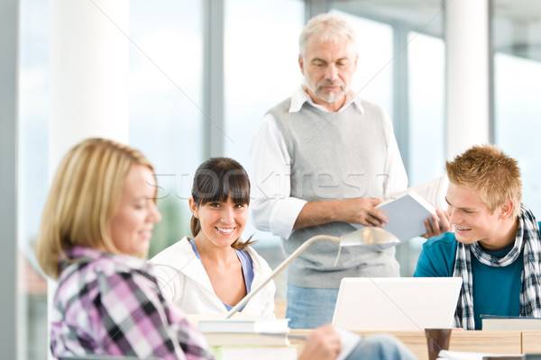 High school - three students with mature professor Stock photo © CandyboxPhoto