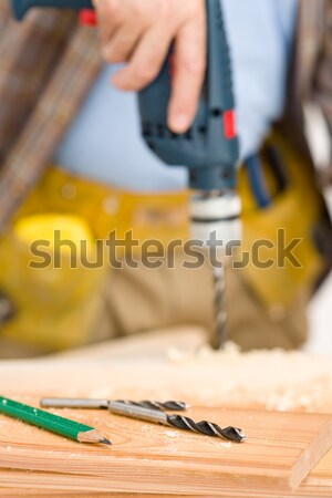 Home improvement - handyman sanding wooden floor Stock photo © CandyboxPhoto