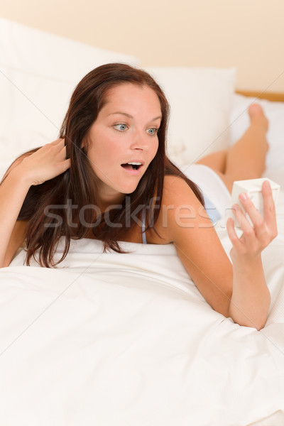 Stock photo: Shocked woman wake-up bed watch alarm clock