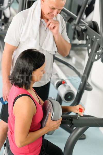 Fitness trainer adjust machine active man exercise Stock photo © CandyboxPhoto