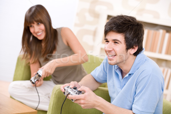 Student - happy teenagers playing video game with control pad  Stock photo © CandyboxPhoto
