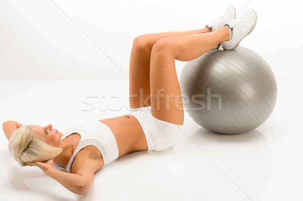 Woman doing sit-ups on fitness ball white Stock photo © CandyboxPhoto