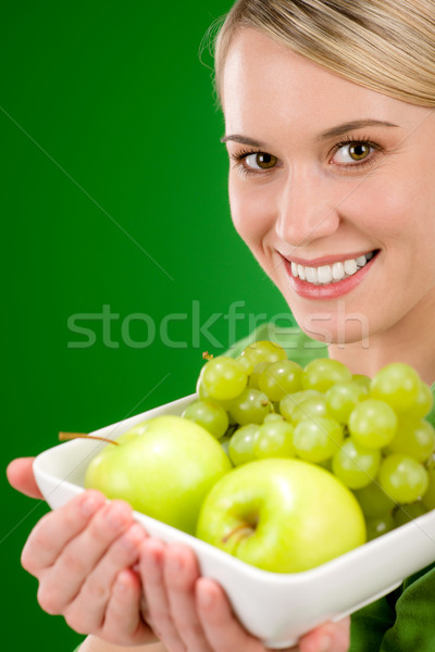 Healthy lifestyle - woman holding bowl with green fruit Stock photo © CandyboxPhoto