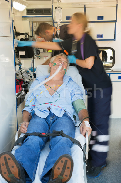 Paramedical team treating patient on stretcher Stock photo © CandyboxPhoto