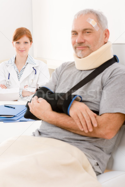 Senior patient broken arm in doctor office Stock photo © CandyboxPhoto