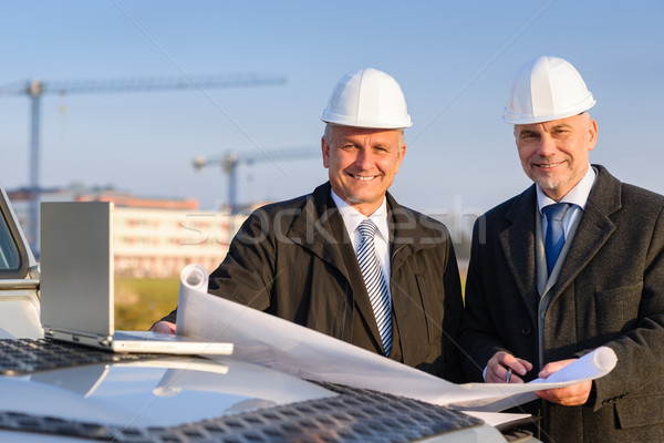 Architect developer hold construction plan Stock photo © CandyboxPhoto