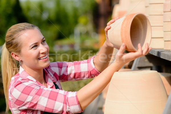 Garden center woman putting clay pots shelf Stock photo © CandyboxPhoto