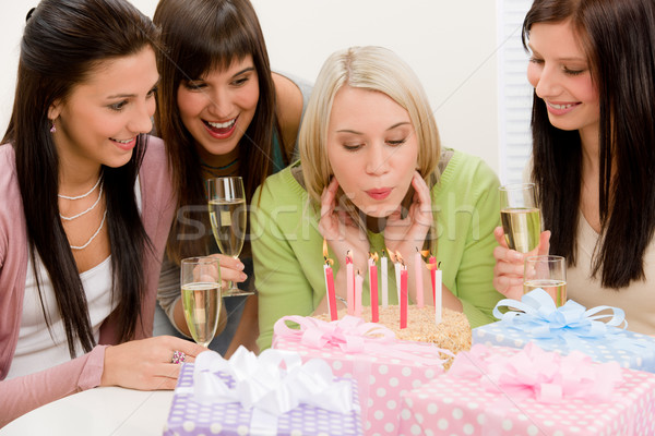 Birthday party - woman blowing candle on cake Stock photo © CandyboxPhoto