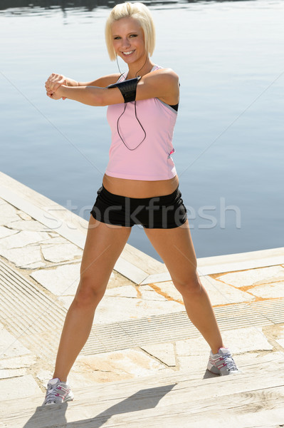 Fit woman stretch body by pier marina Stock photo © CandyboxPhoto