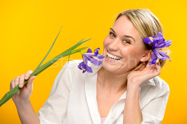 Smiling woman with spring flower in hair Stock photo © CandyboxPhoto