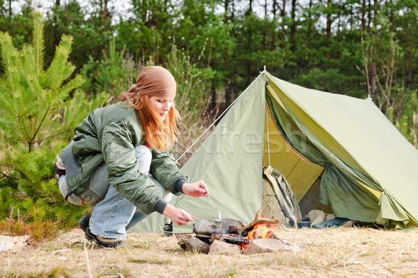 Camping woman tent cook food fire nature Stock photo © CandyboxPhoto