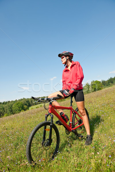 Young woman with mountain bike in spring nature Stock photo © CandyboxPhoto