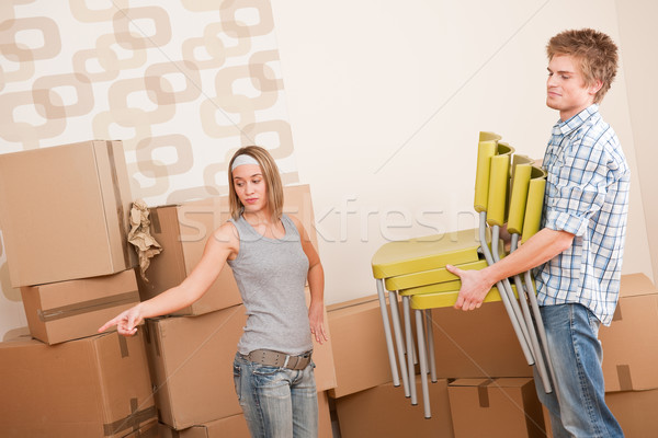 Moving house: Man and woman with box and chair Stock photo © CandyboxPhoto