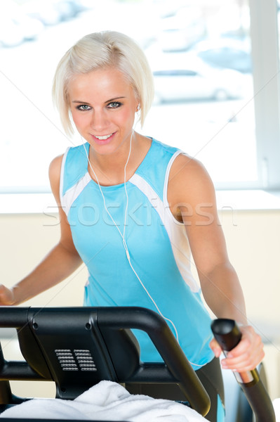 Fitness young woman on elliptical cross trainer Stock photo © CandyboxPhoto